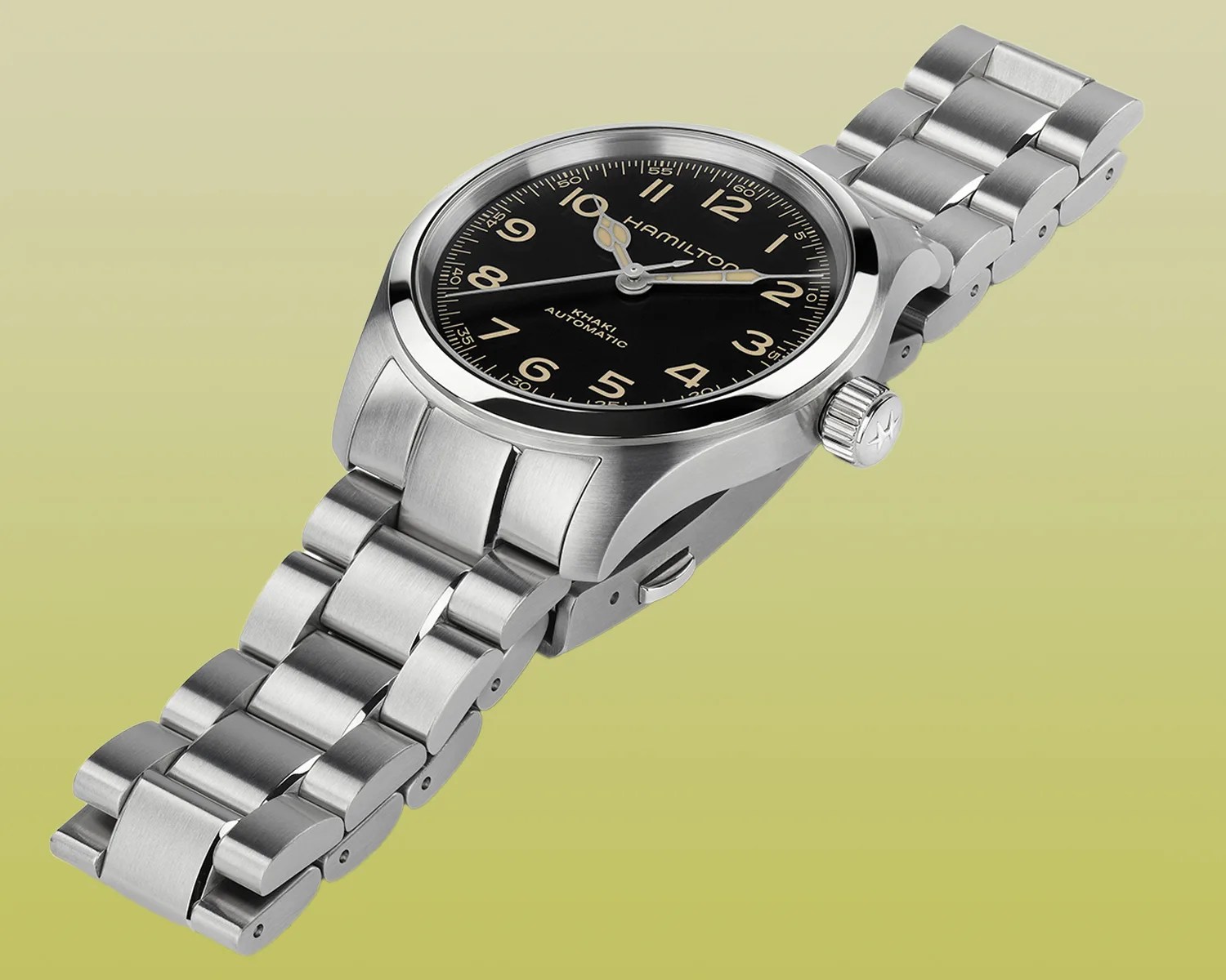 hamilton watch against a yellow background