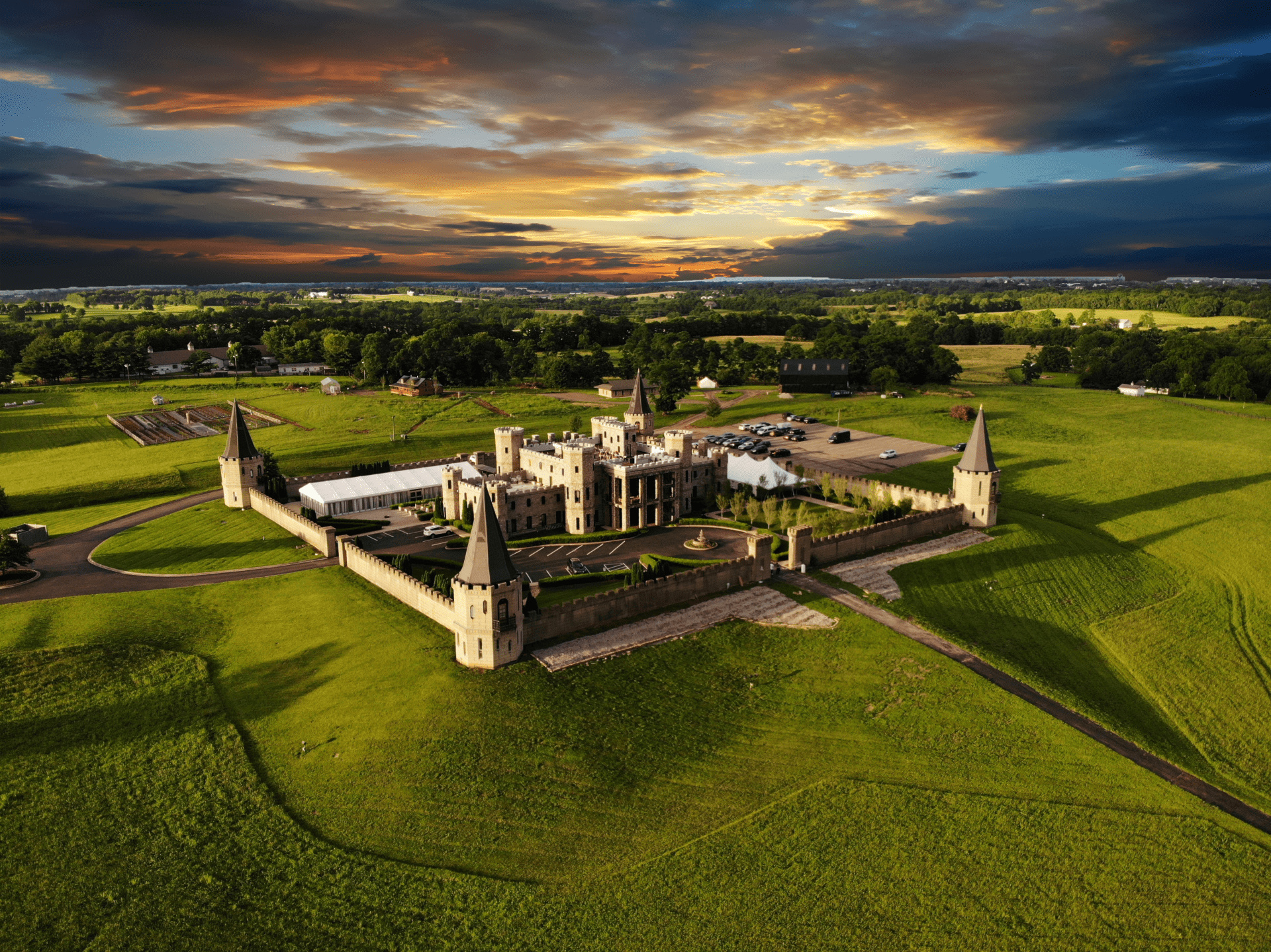 An aerial rendering of the Kentucky Castle with a sunset in the backgroun