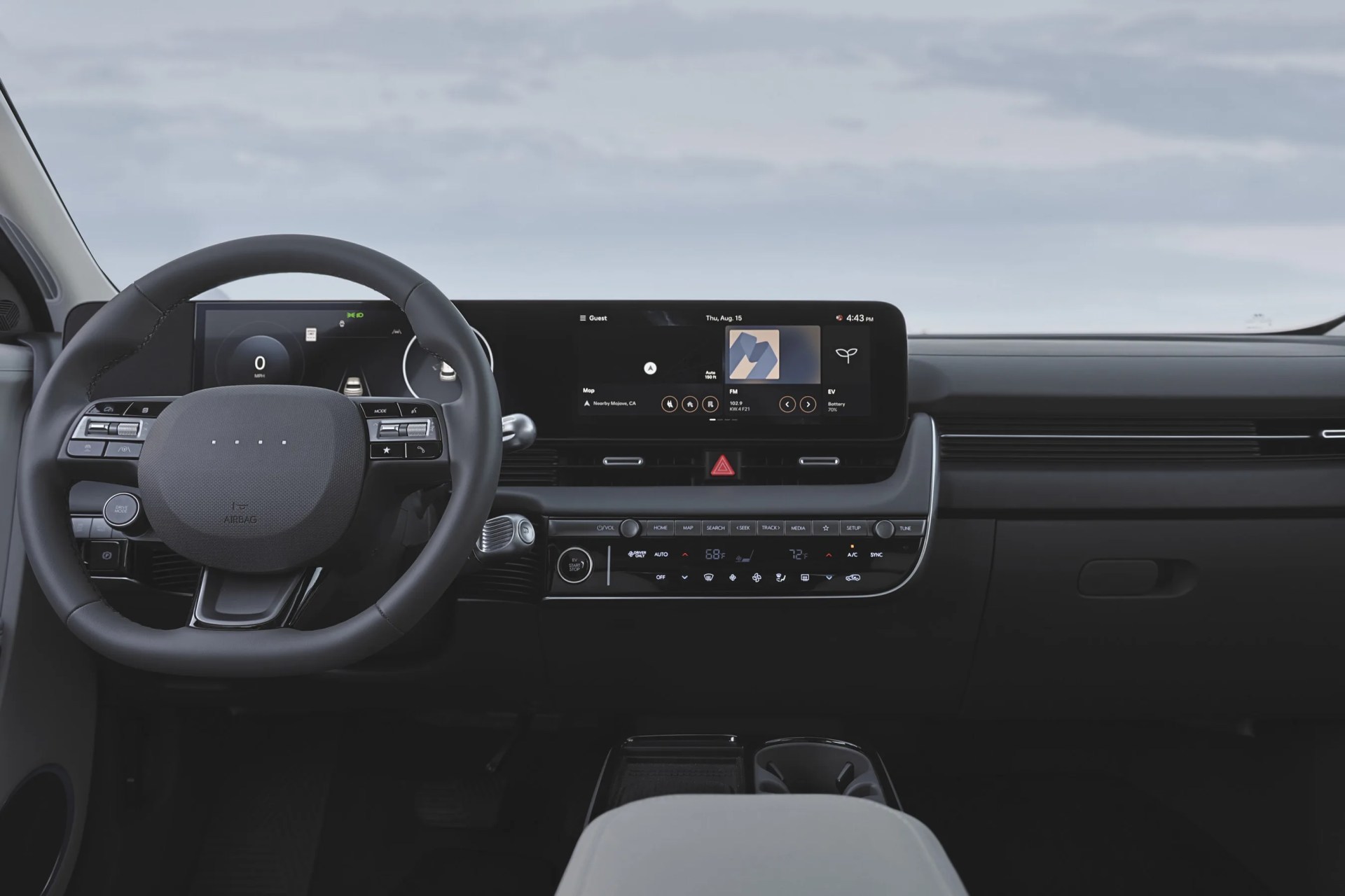The steering wheel and central infotainment screen of the 2025 Hyundai Ioniq 5.