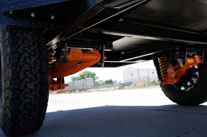 An image showing the rear suspension of the Boreas UB trailer under the trailer's two wheels