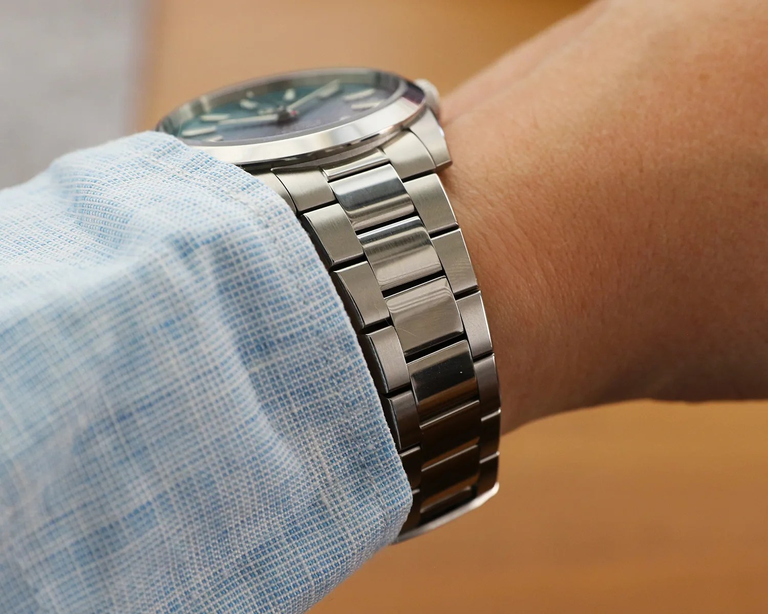 a jack mason watch on a bracelet worn on a mans wrist