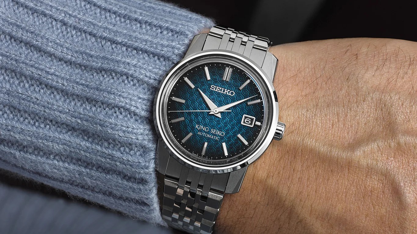 seiko watch on the wrist of a man wearing a sweater