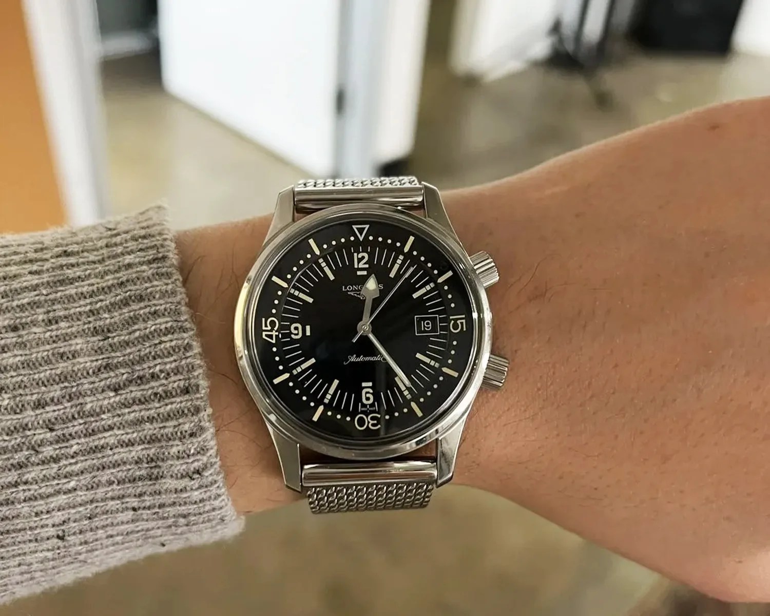 a black watch on a man's wrist