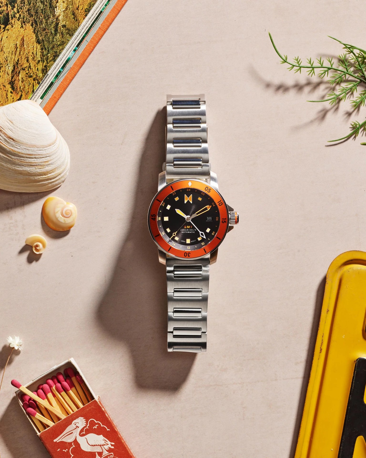 watch with shells and plant