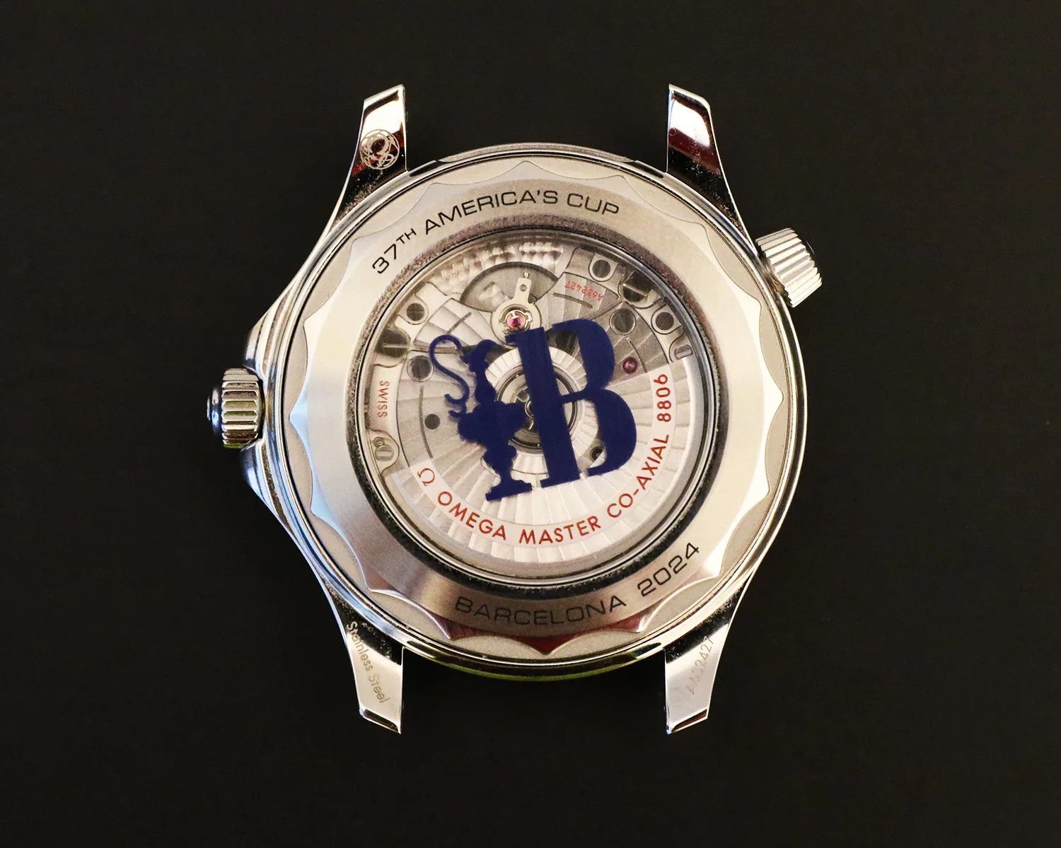 omega watch movement seen through a display caseback