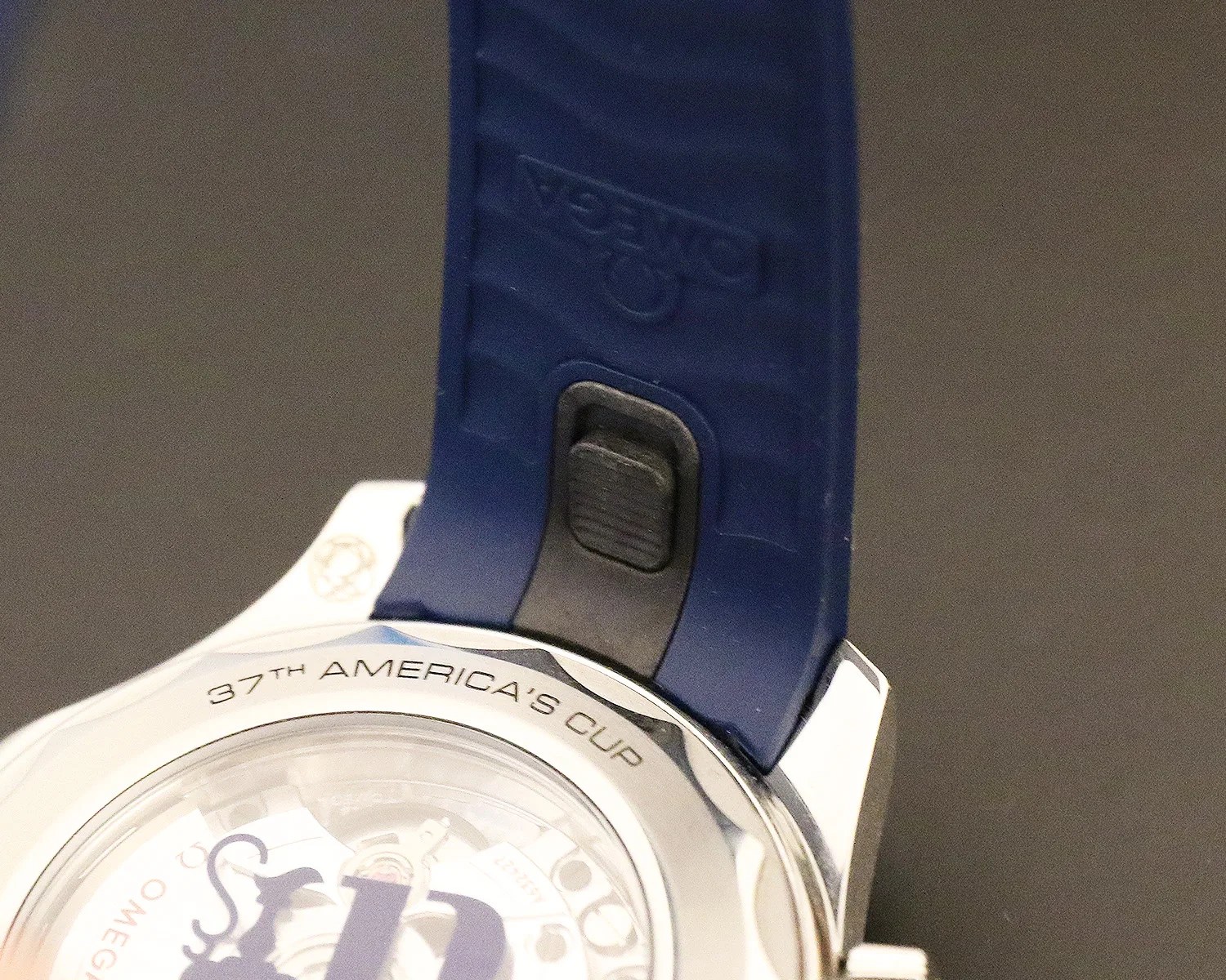 closeup of an omega rubber strap and caseback