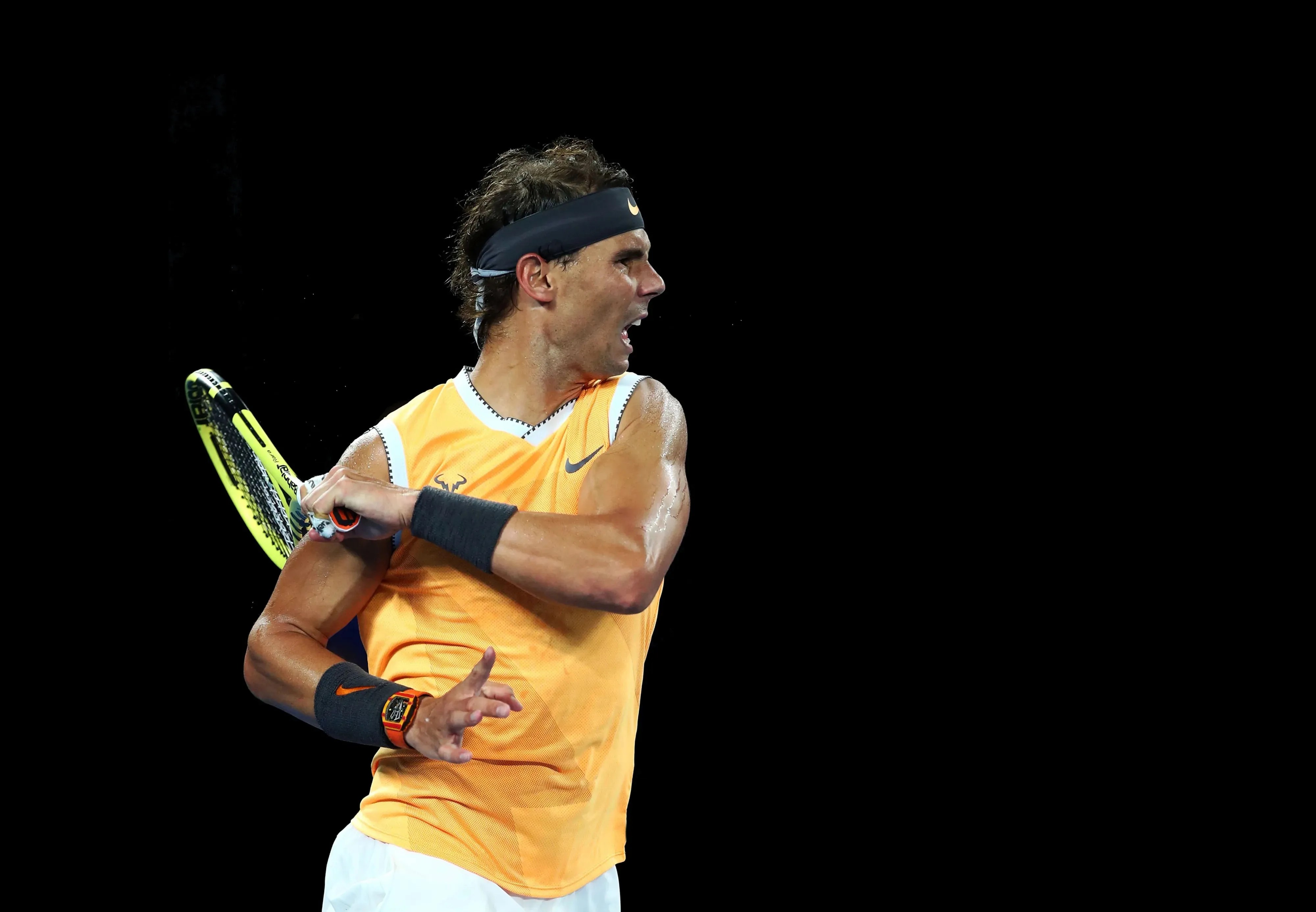 rafa nadal plays tennis while wearing a richard mille watch