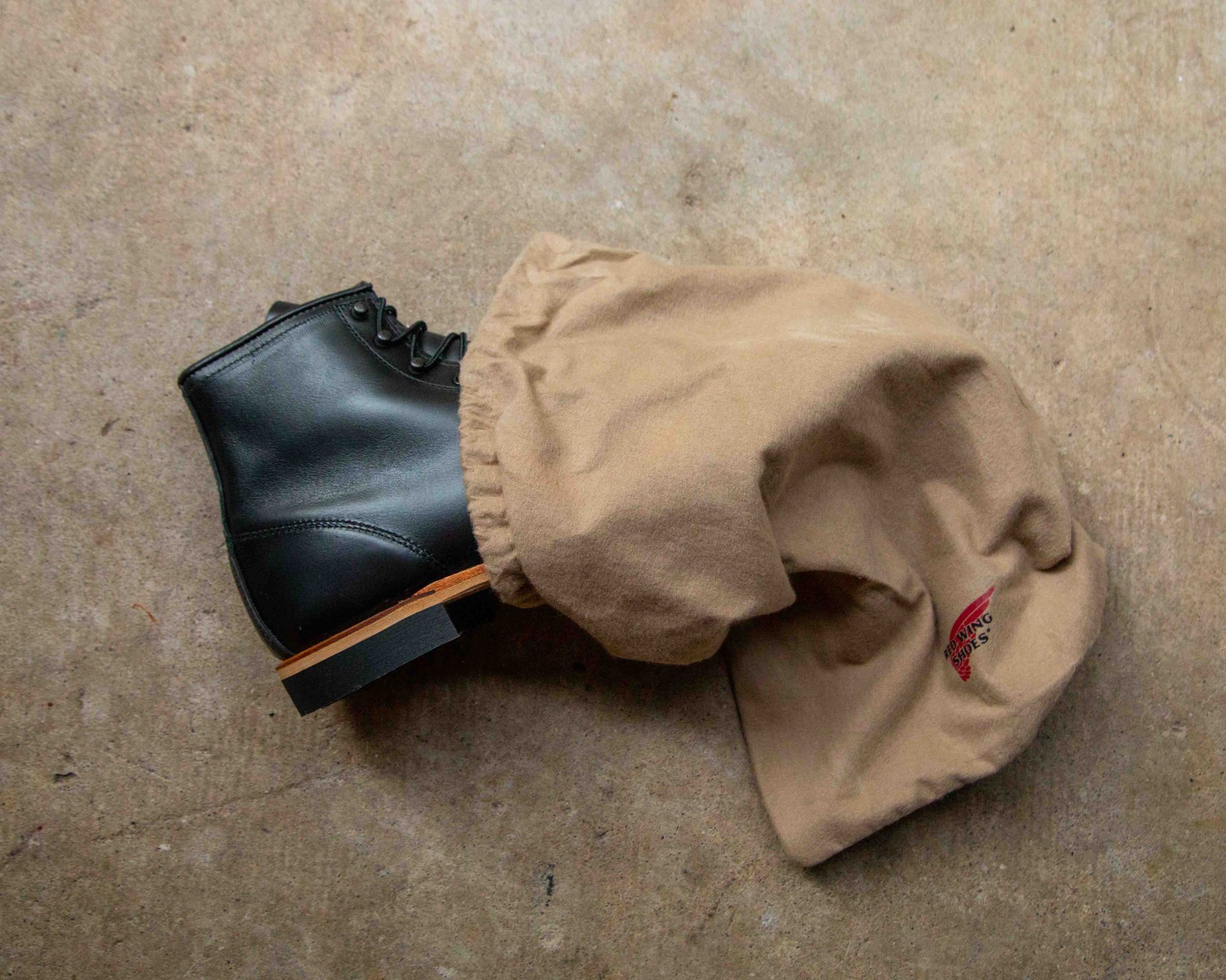 red wing black boot in shoe bag