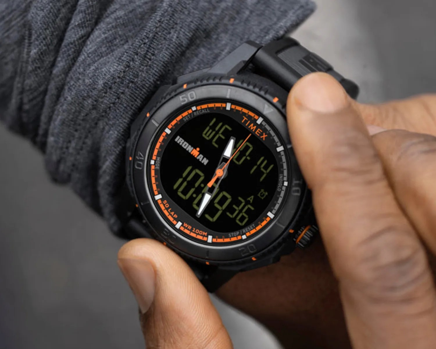 Timex watch on a mans wrist as he grips the bezel