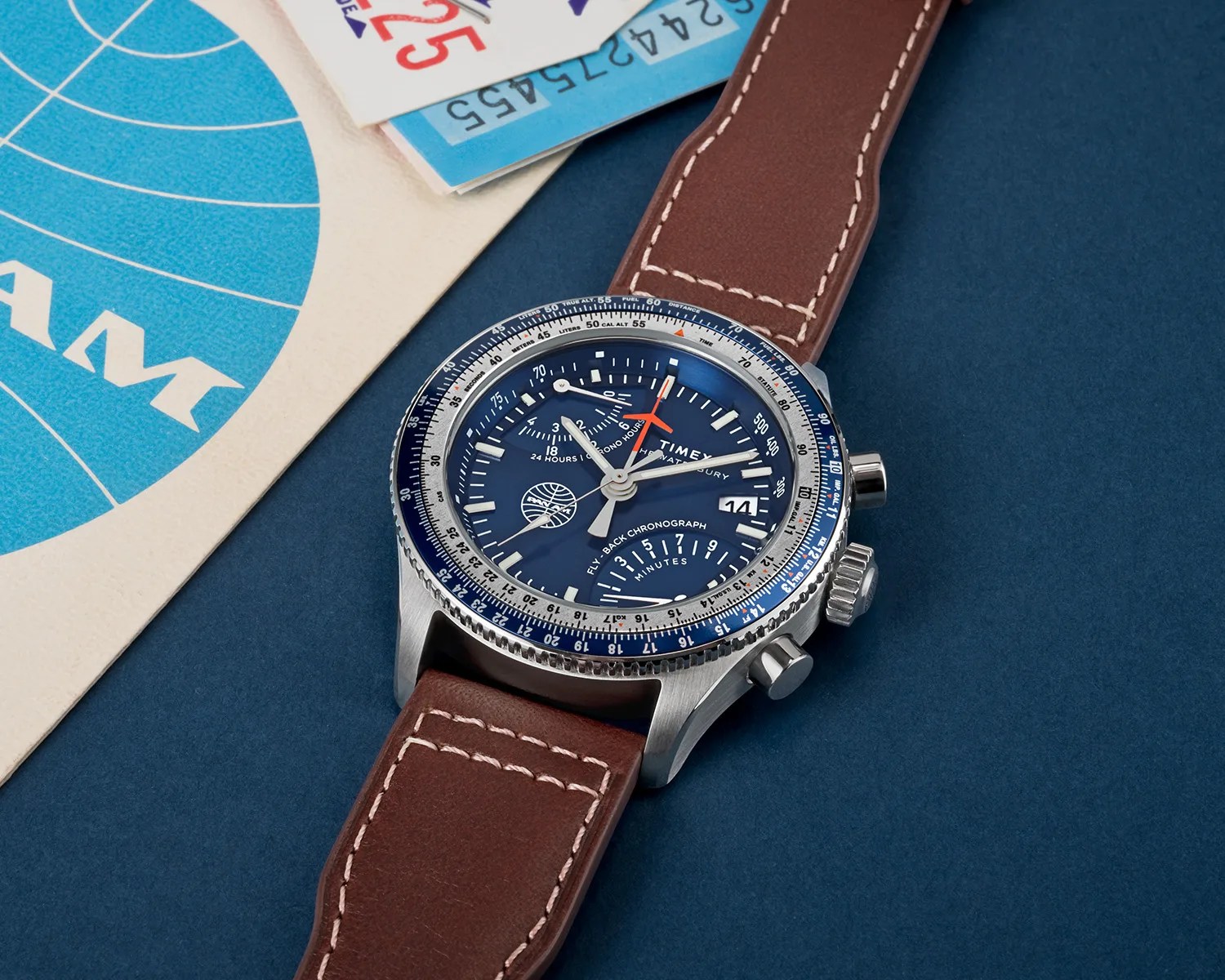 timex watch near an airline ticket