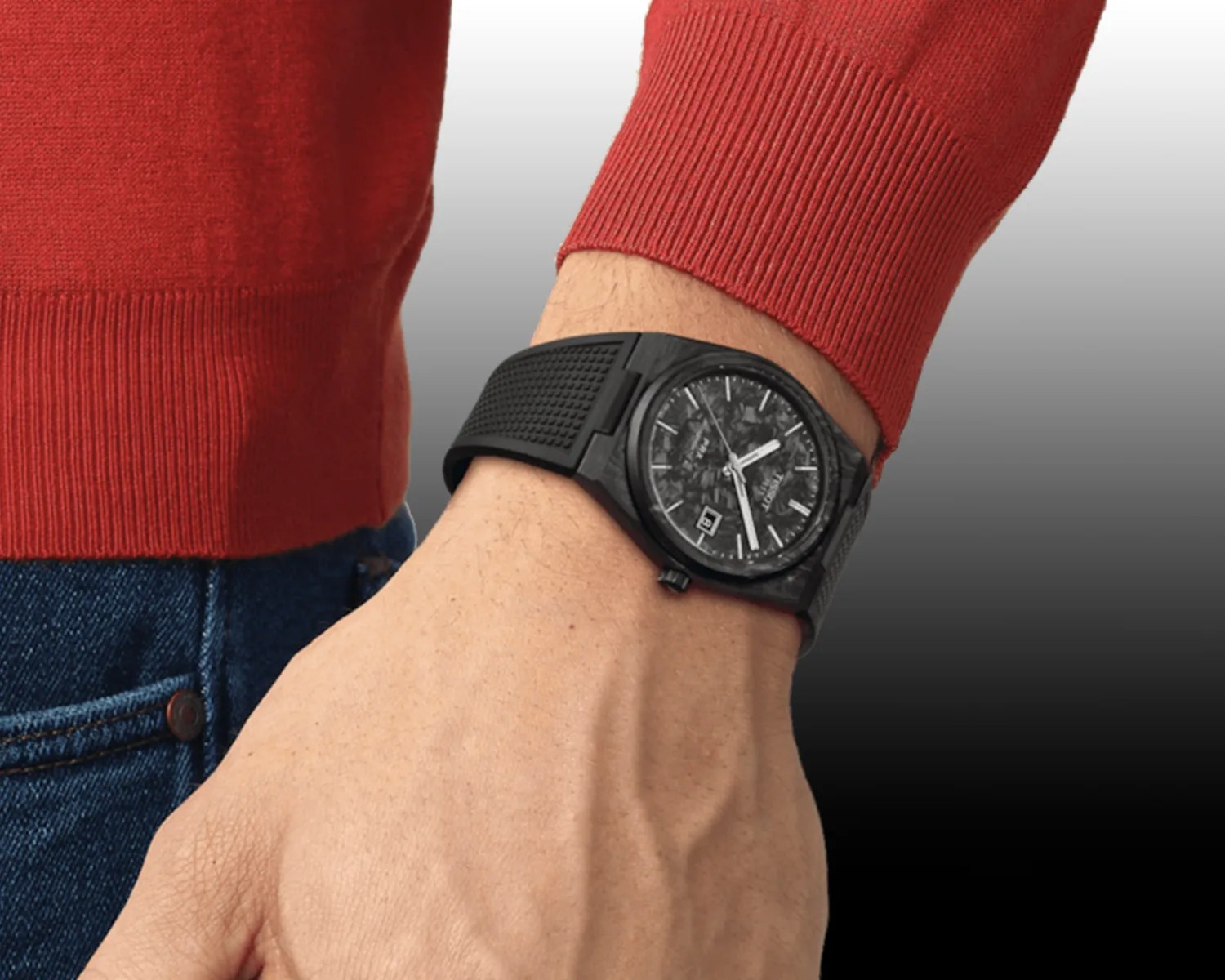 black tissot watch on a mans wrist