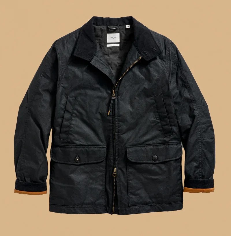 Billy Reid Hunting Jacket shown laid flat and zipped up on a light tan background.
