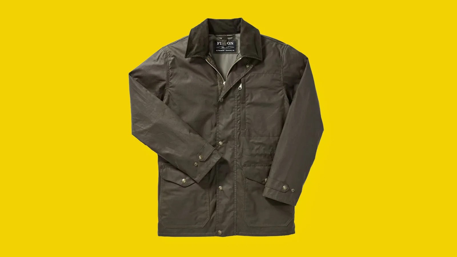 Filson Cover Cloth Mile Marker Coat in otter green shown on a bright yellow background