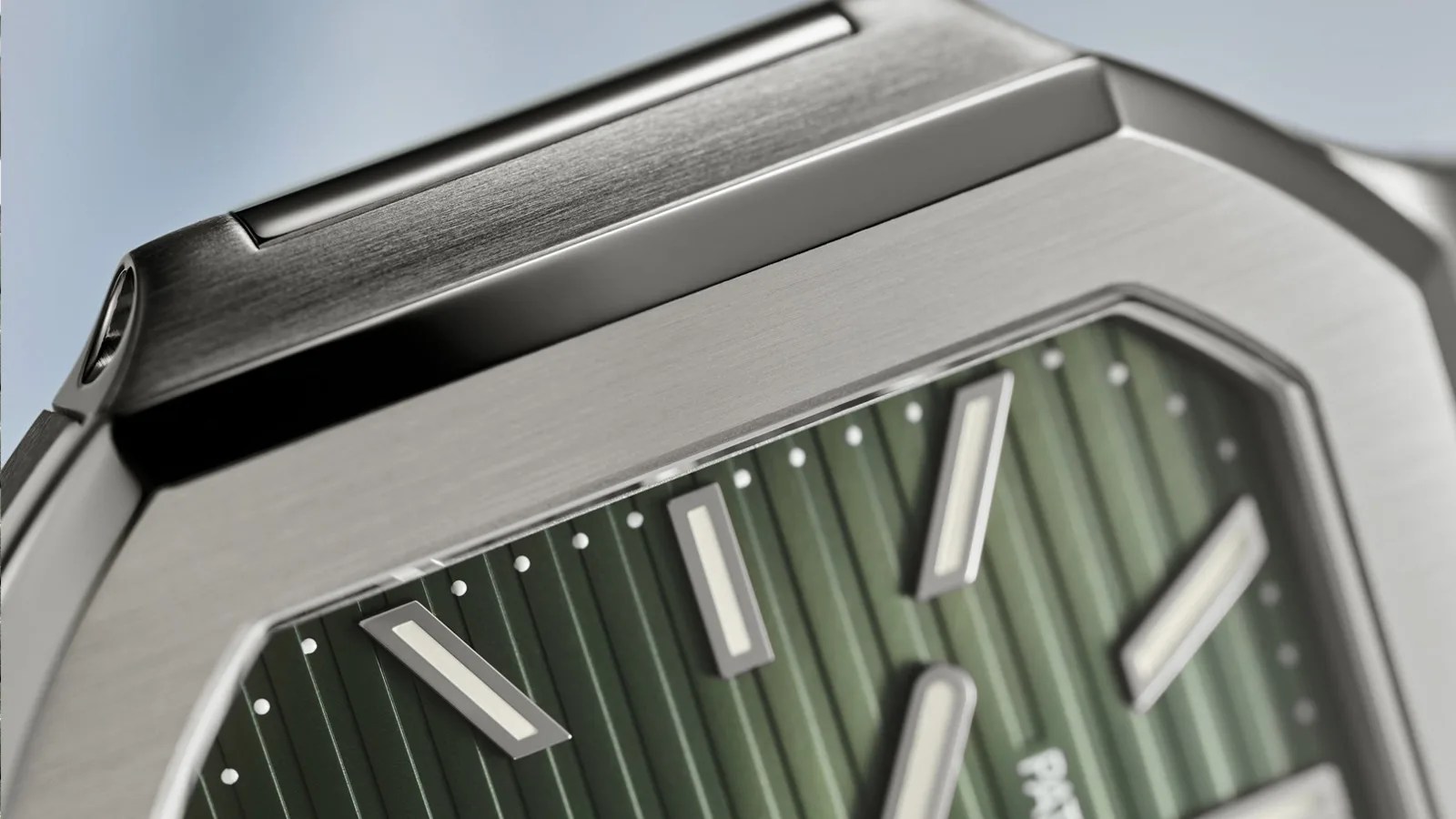 A close up shot of the left hand edge of the Patek Phillippe 5821/1A Cubitus Watch highlighting the edge of the case and teasing its dark green dial