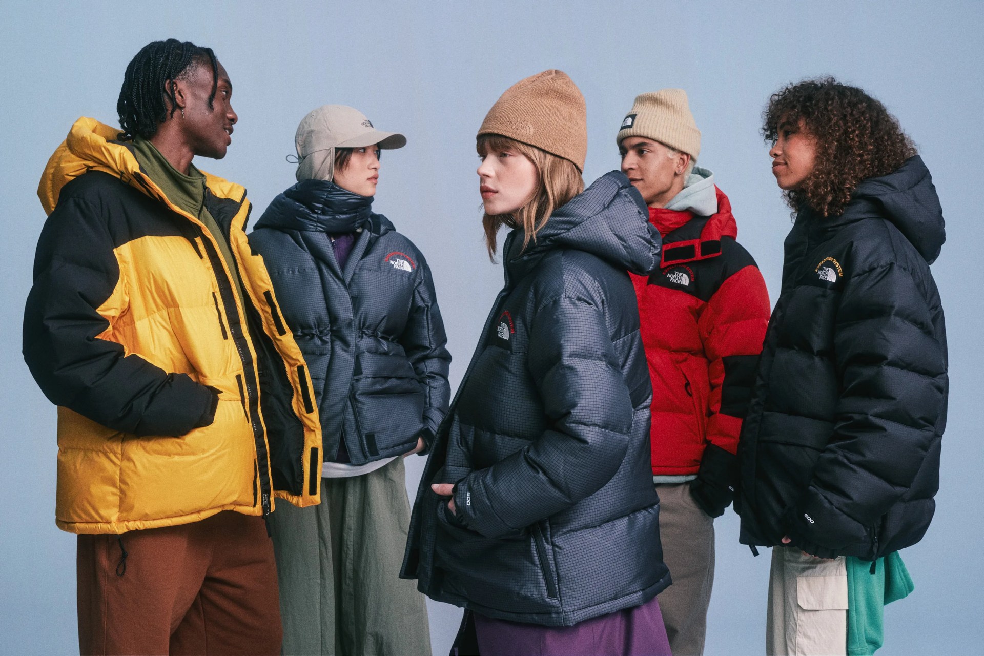 group of people wearing parkas in photography studio