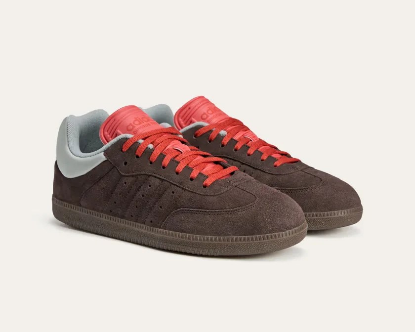 brown suede adidas sneakers with red accents
