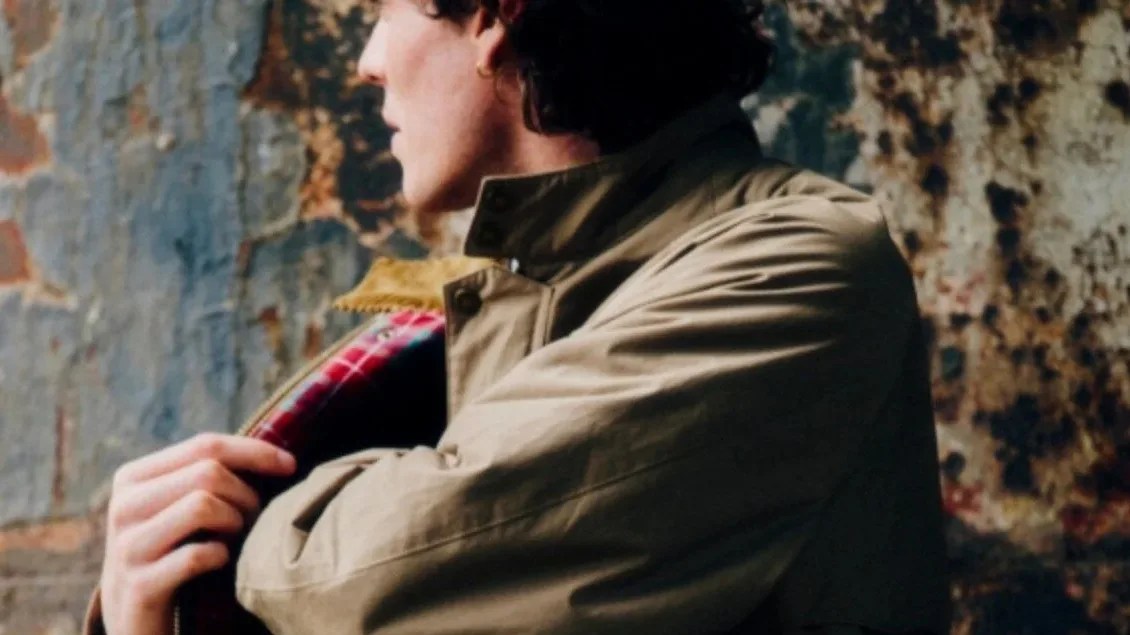 man wearing a tan jacket