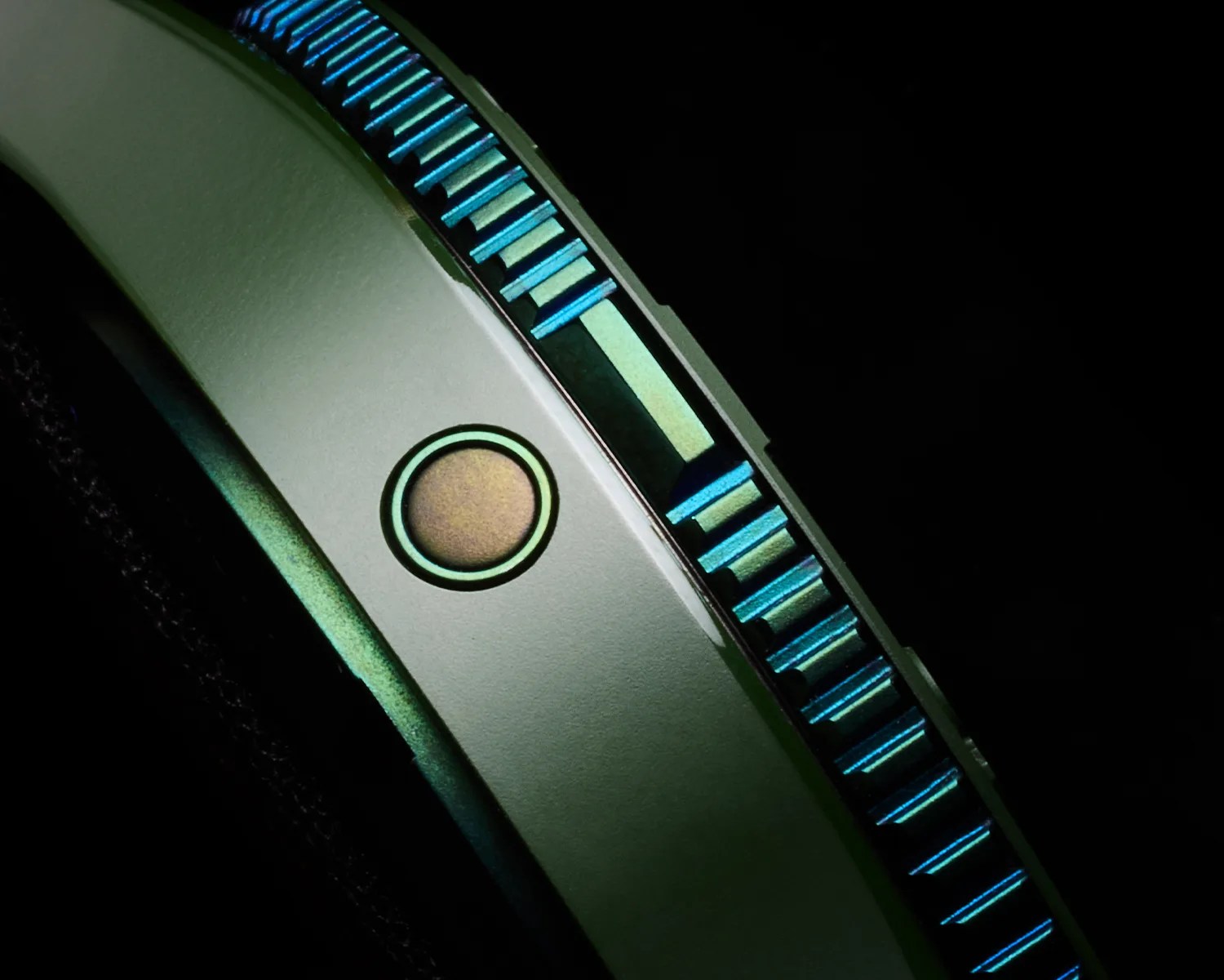a closeup of the helium escape watch on a green ceramic Bremont dive watch