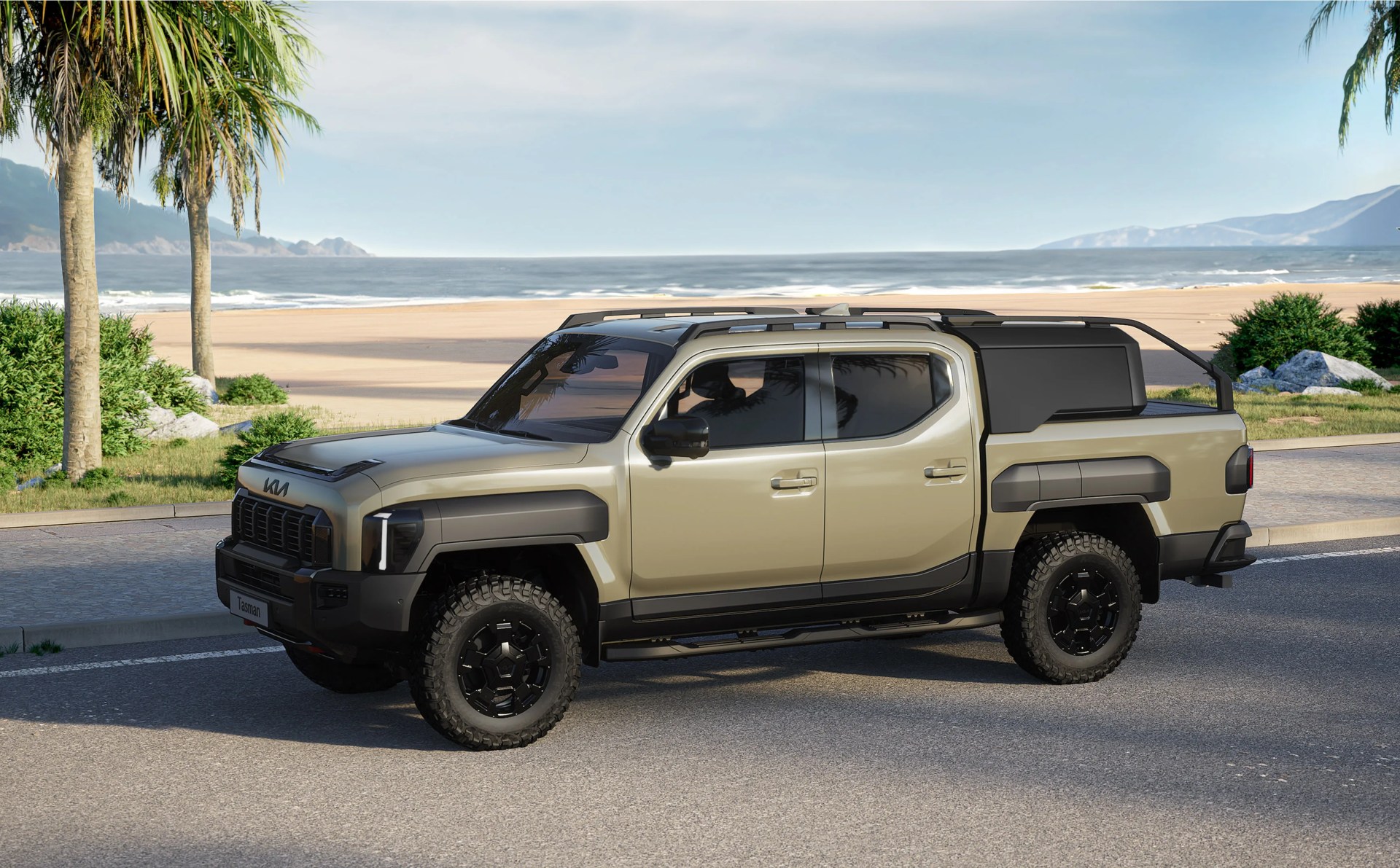 A rendering of the Kia Tasman Truck shown with a special bed cargo accessory driving on a road next to a beach with the ocean in the background. 