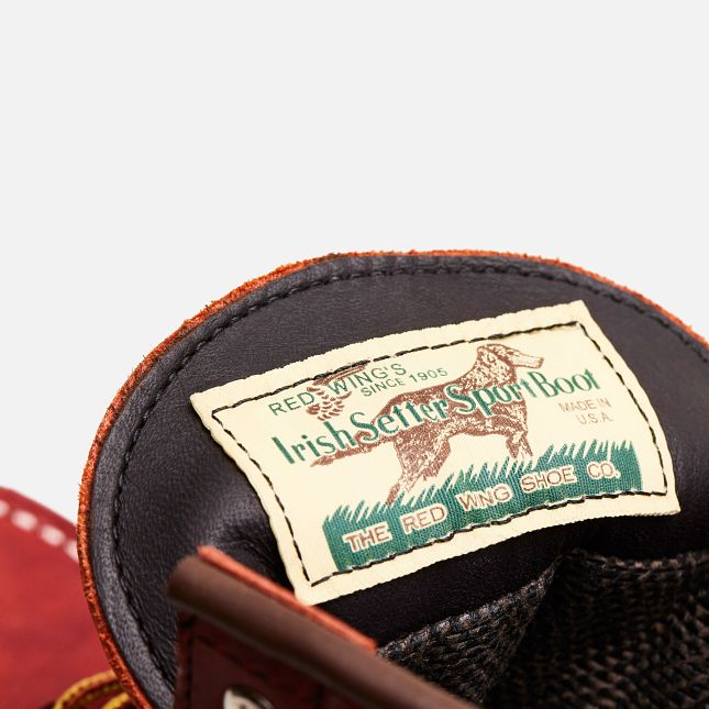 A close up of the tongue tag of the Red Wing Heritage GORE-TEX Classic Moc boot showing the Irish Setter SportBoot logo.