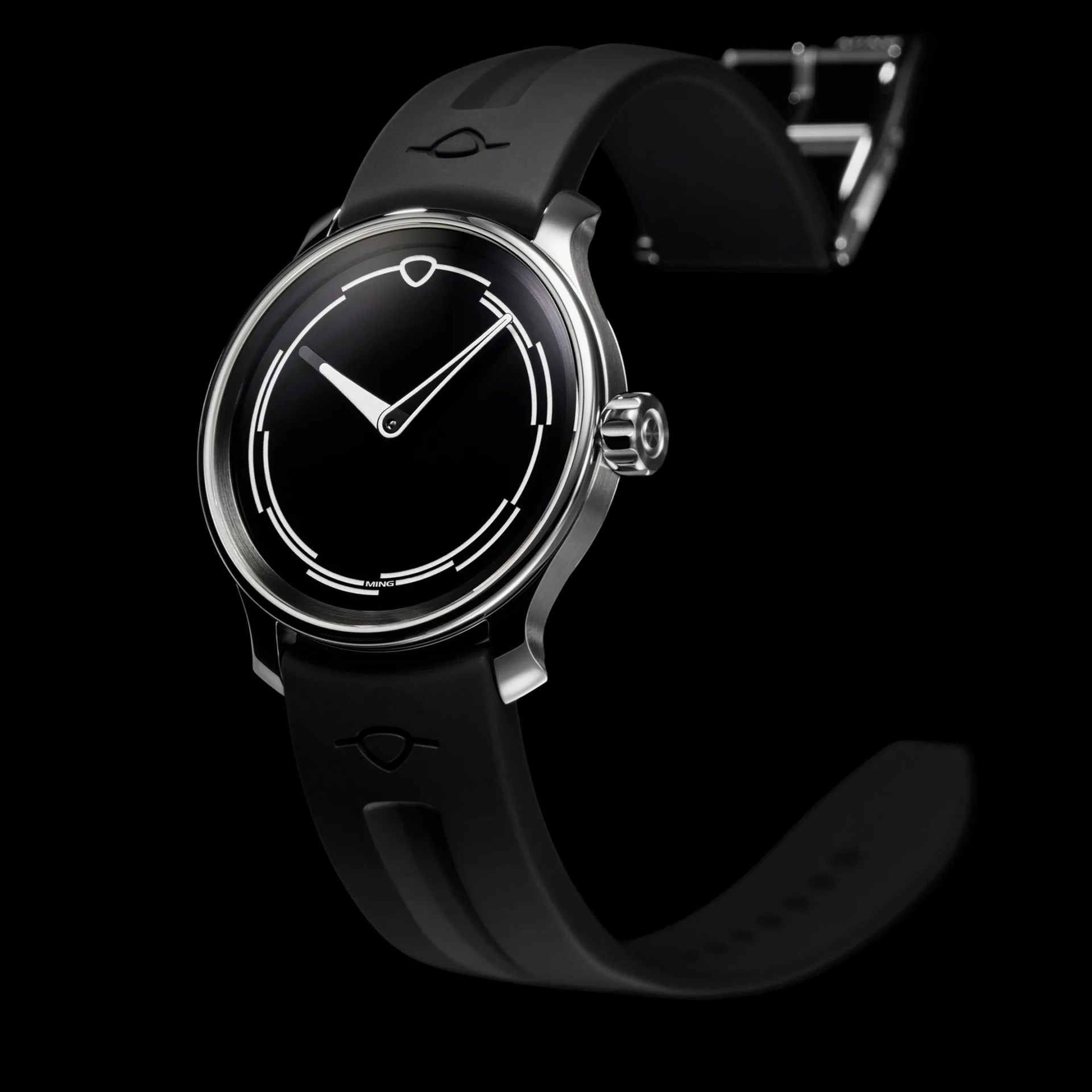 a ming watch floats in blackness