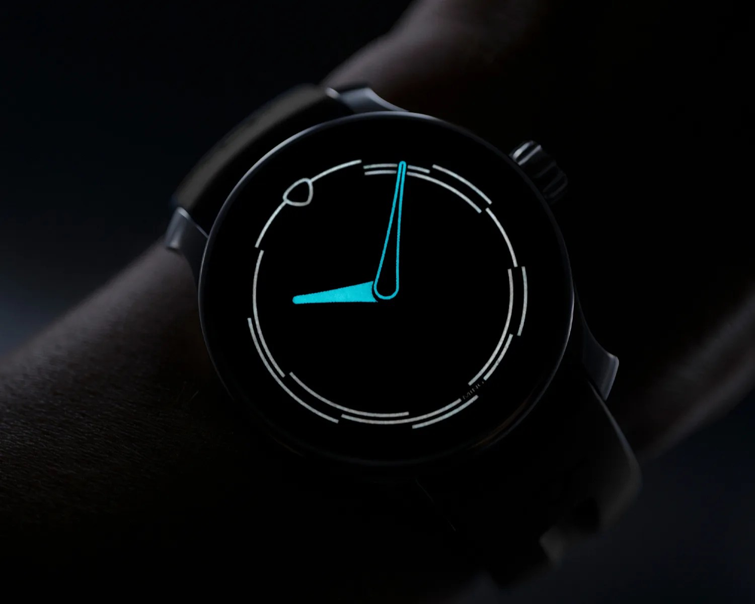 a ming watch glows in the dark on a wrist