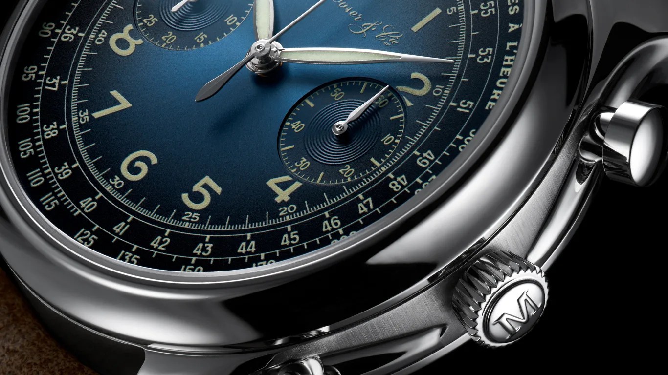 a closeup of a moser x massena lab watch dial