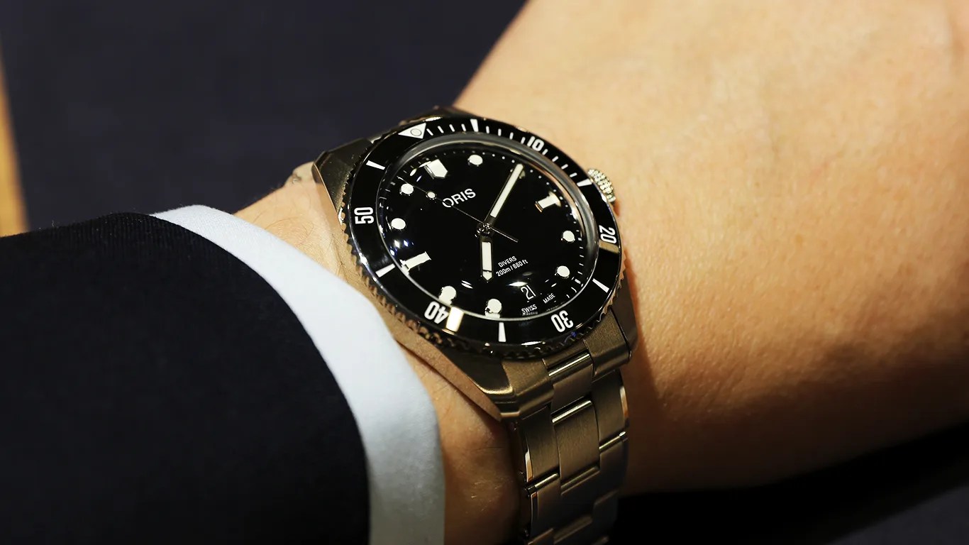 oris dive watch on a mans wrist