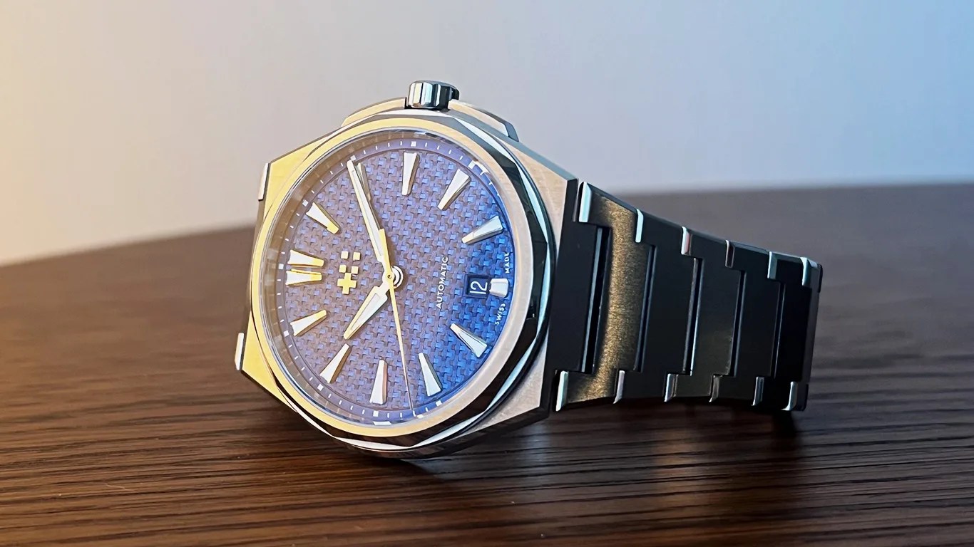 a christopher ward watch on a table