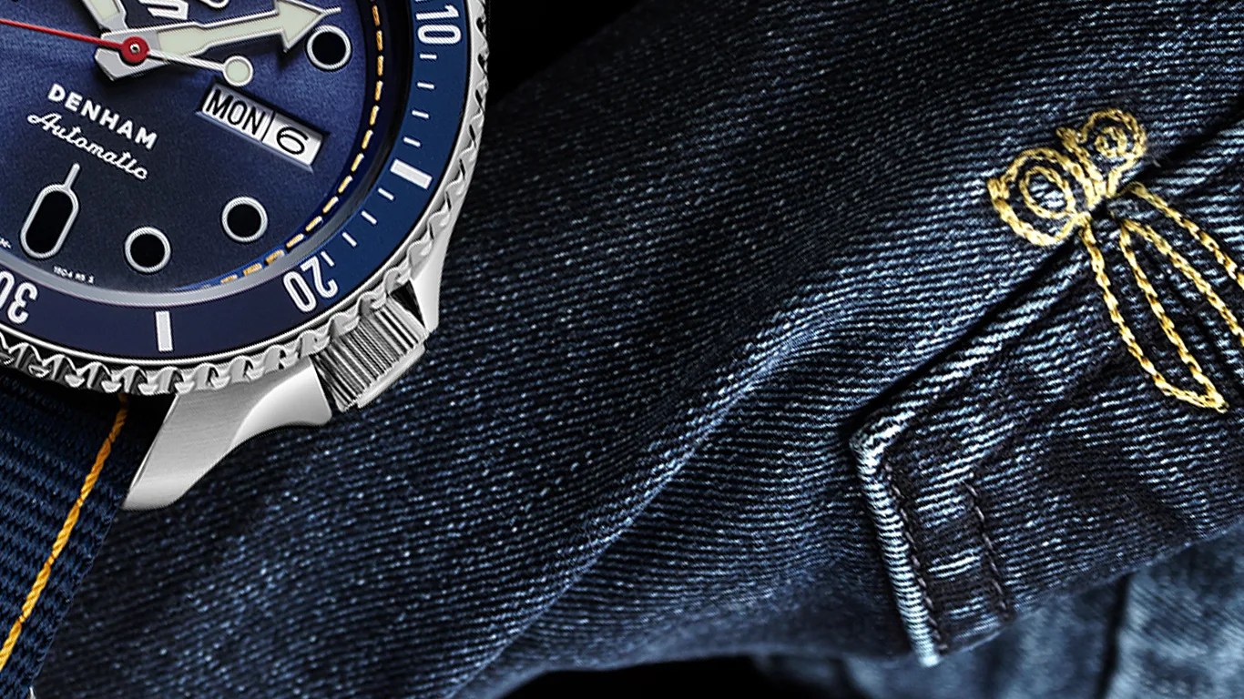a seiko watch on a pair of jeans