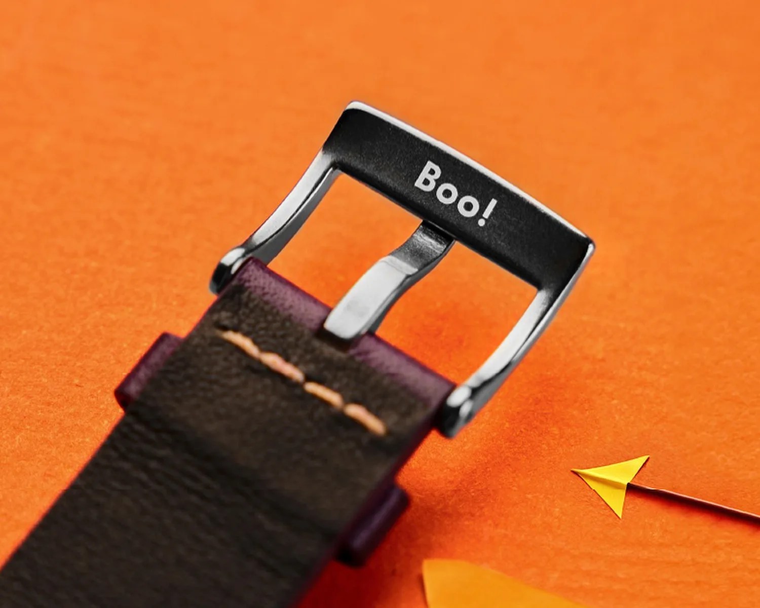 underside of a Spinnaker watch buckle that says boo