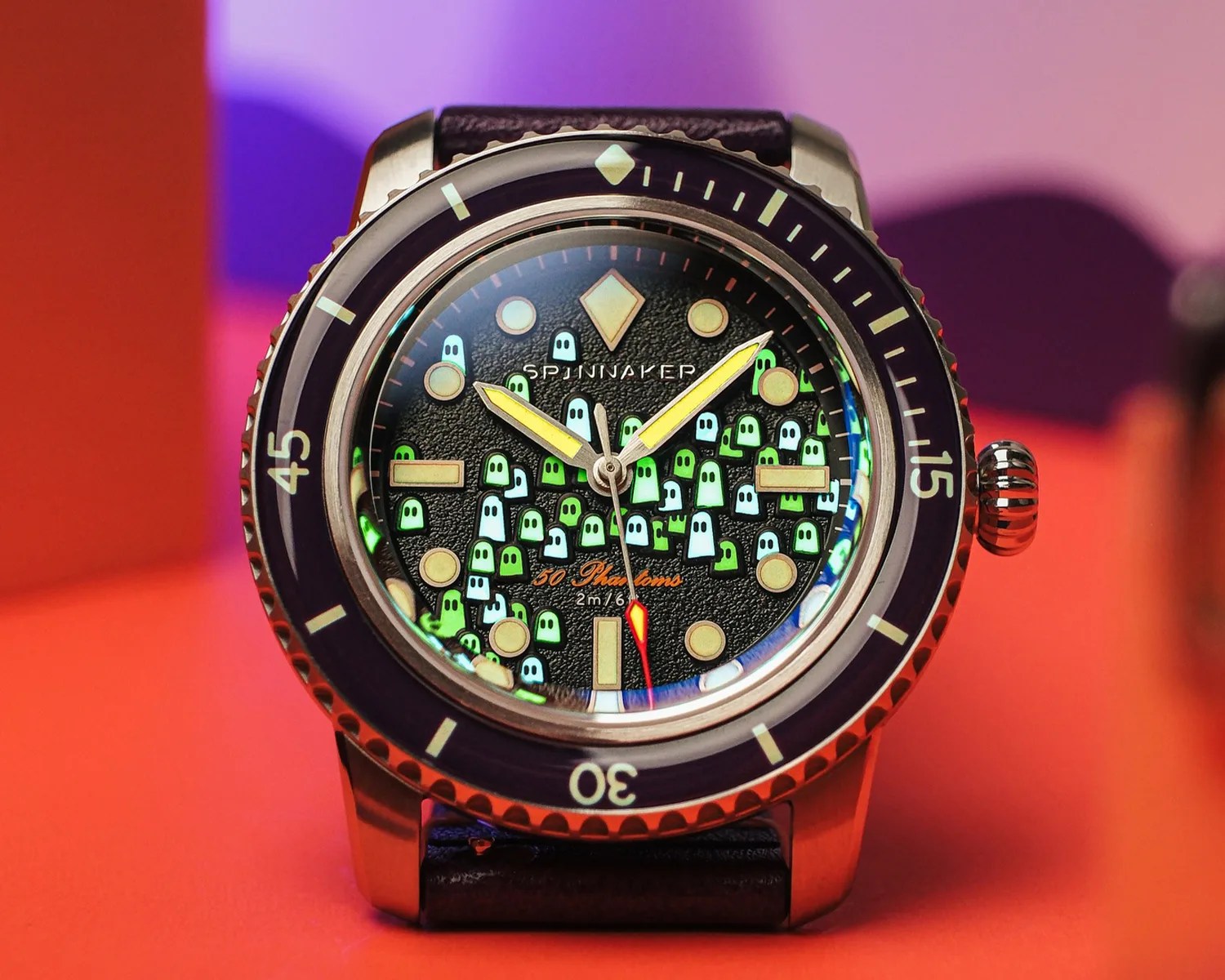 a spinnaker watch with colorful ghosts on its dial