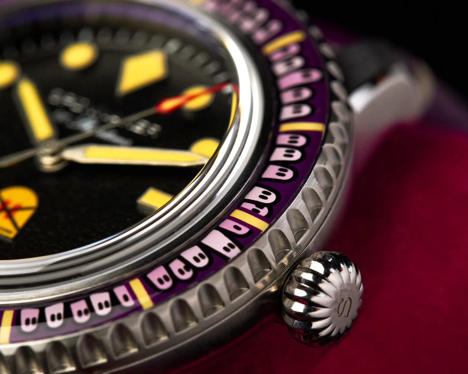 closeup of a Spinnaker watch bezel covered in ghosts