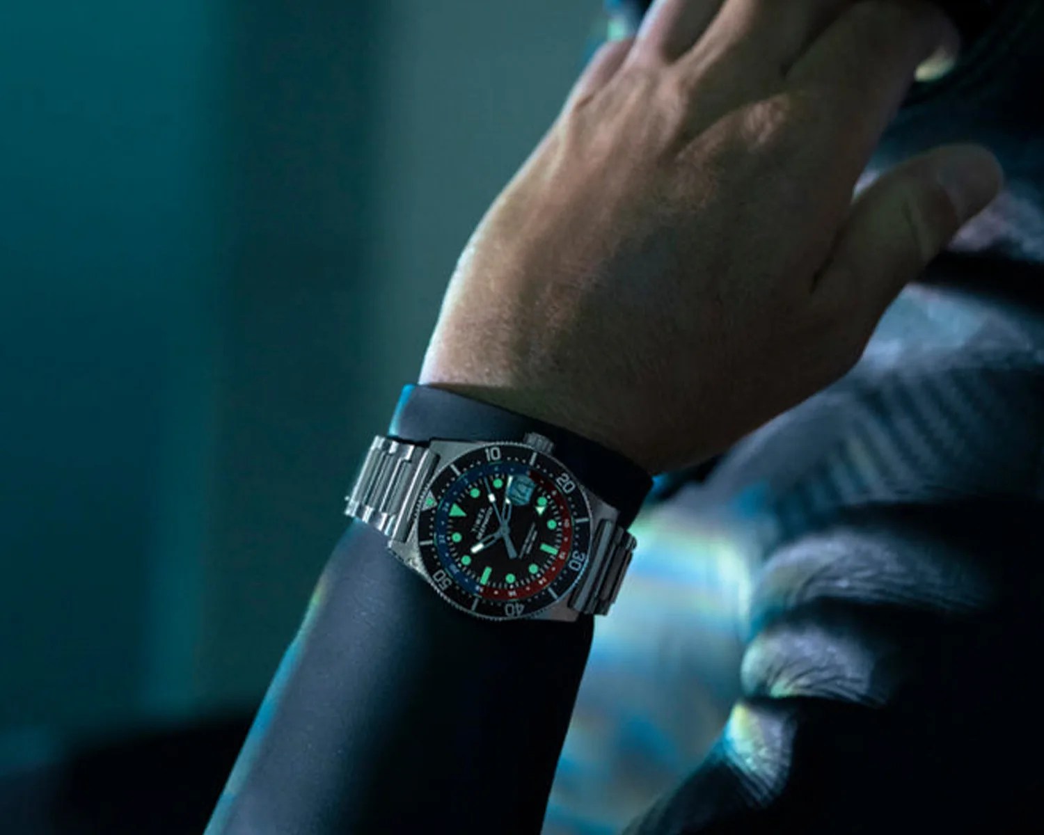 timex dive watch worn by a man wearing a wetsuit