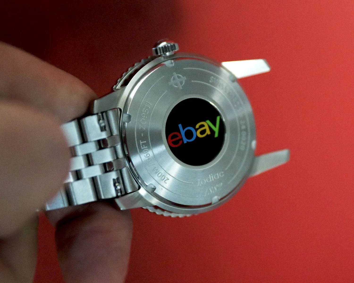 zodiac watch caseback showing the ebay logo