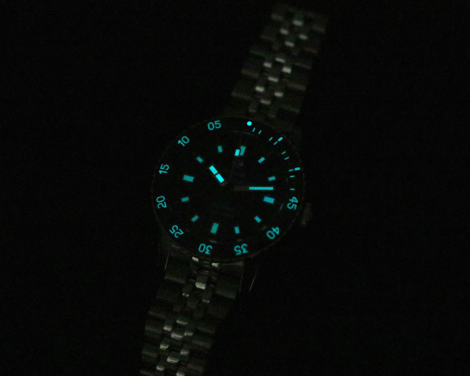 zodiac dive watch with lume glowing in the dark