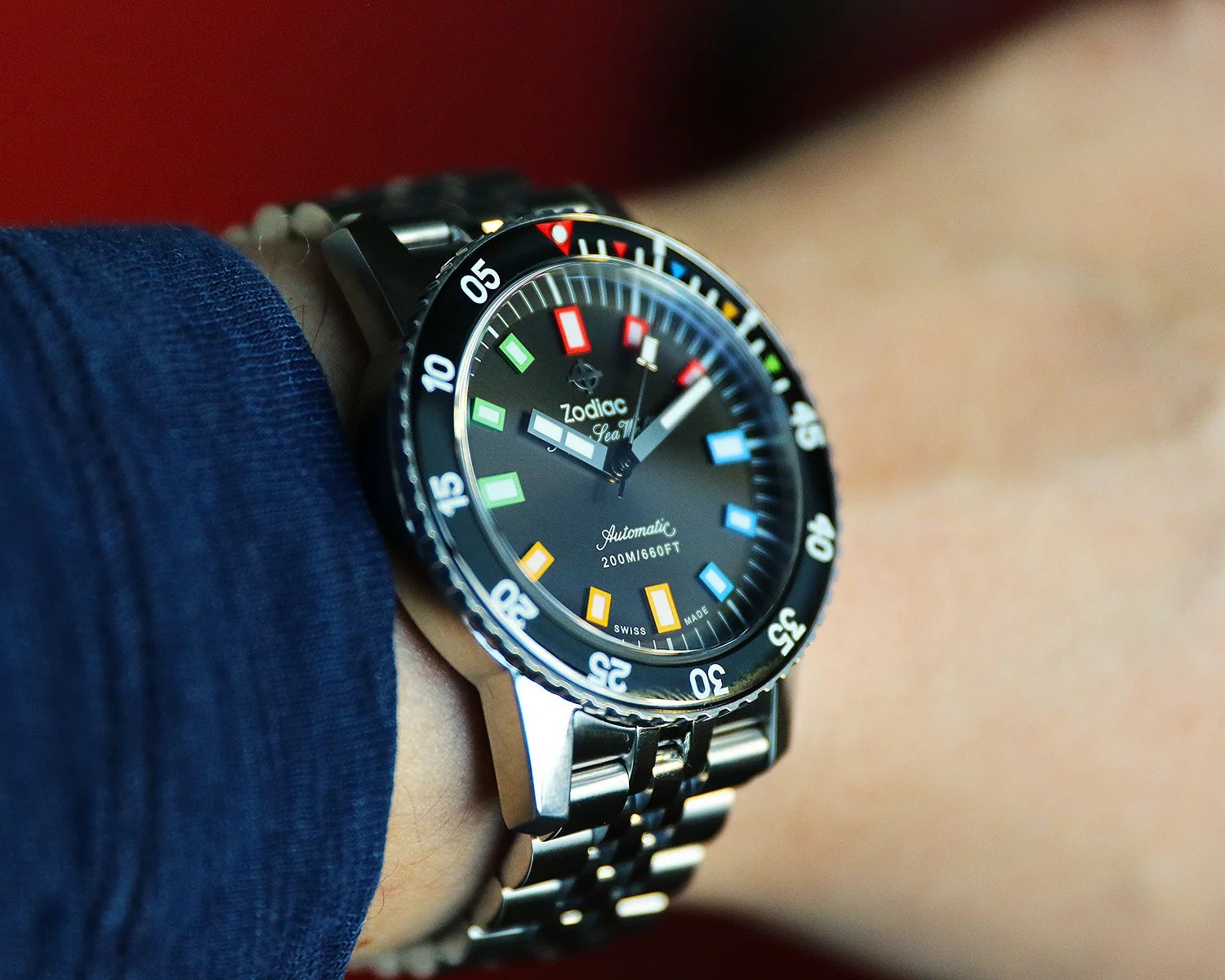 a zodiac dive watch on a mans wrist