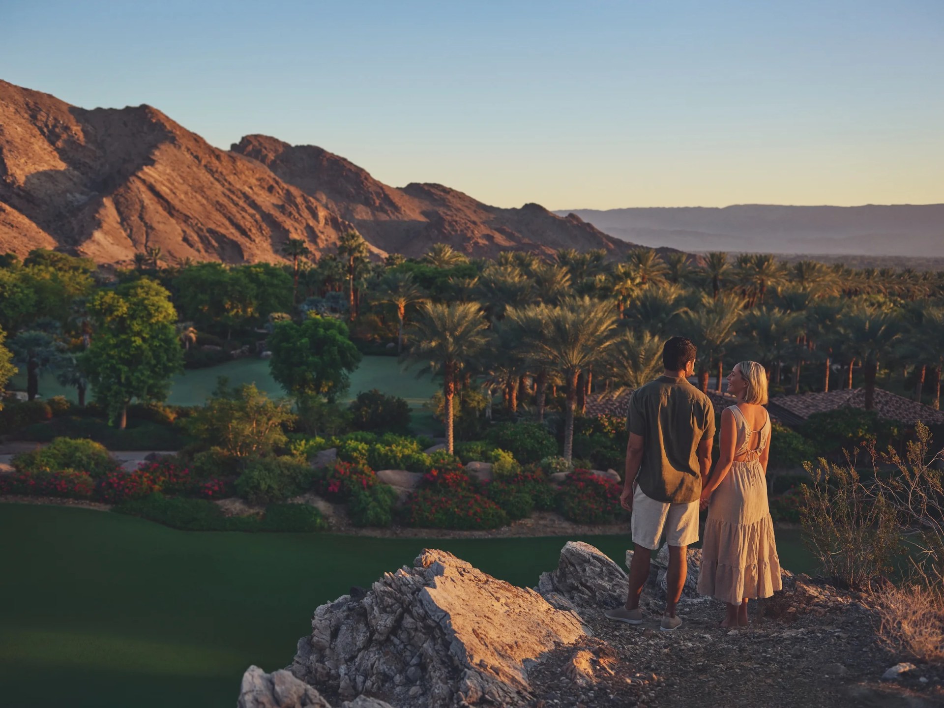 Two people take in a desert landacape view