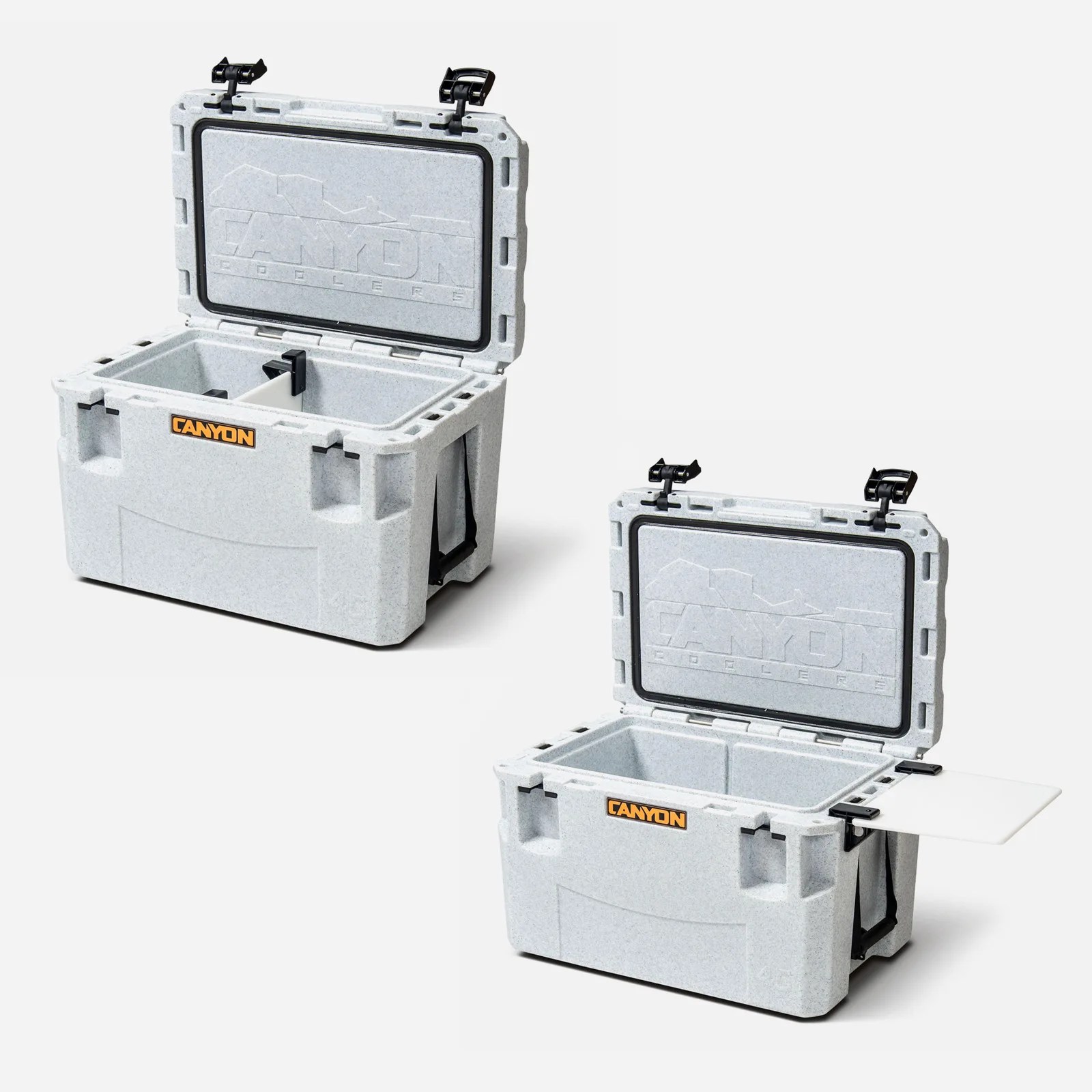 Two Canyon Cooler Pro 45 Coolers shown open. One is in the upper left corner of the image. The other is in the bottom right. Both coolers are a speckled white, greyish color. The top cooler shows how the food grade table can slide in the middle of the cooler to be a divider. The bottom cooler shows how the divider can be attached externally to the cooler to serve as a table.  