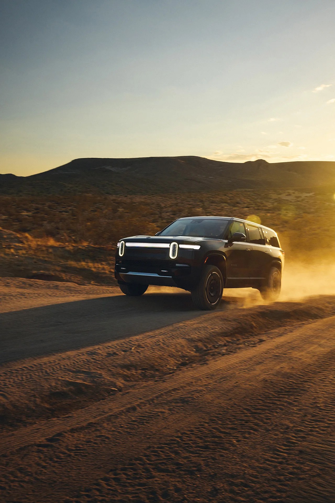 suv offroading in desert driving uphill