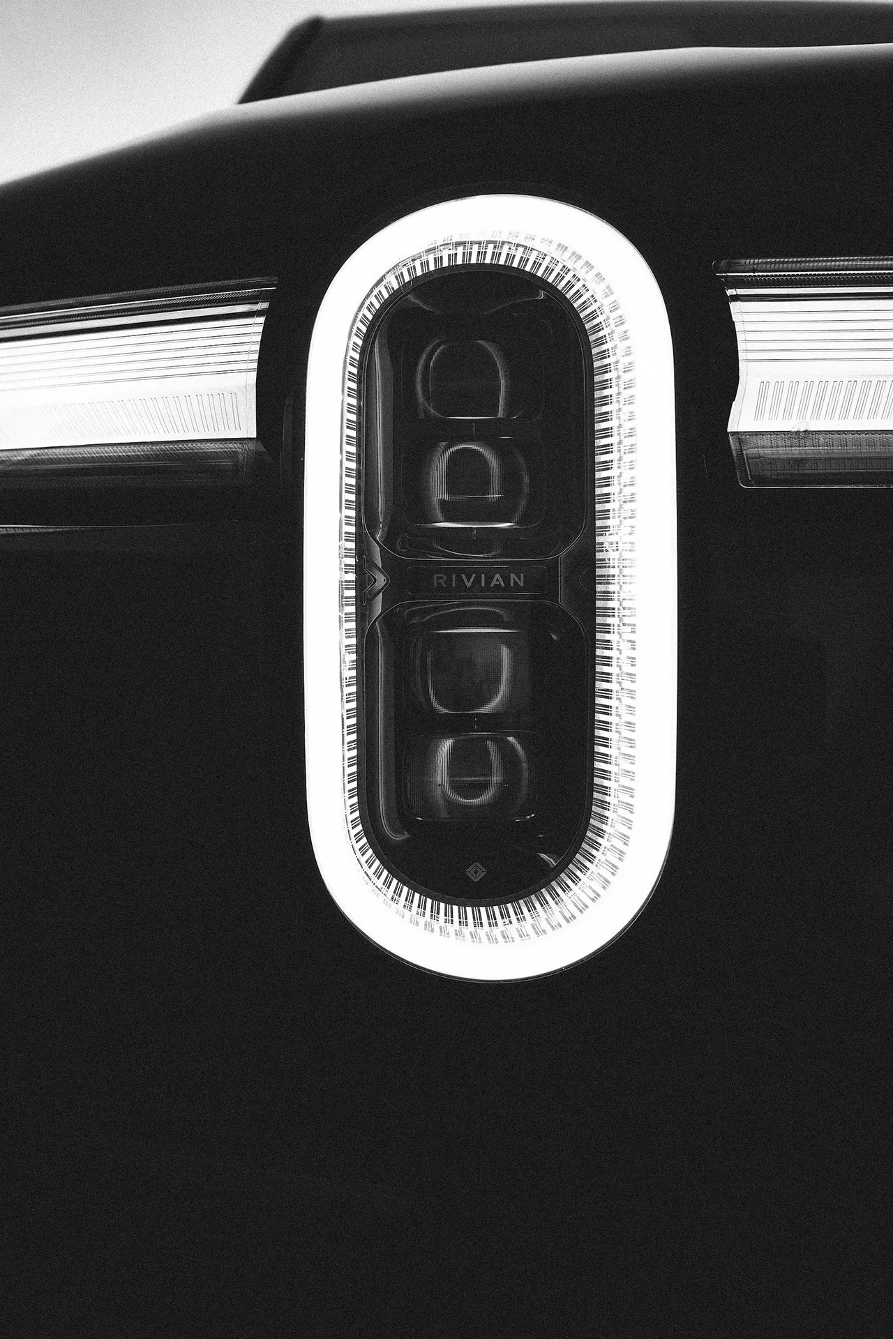 black and white photo of headlight