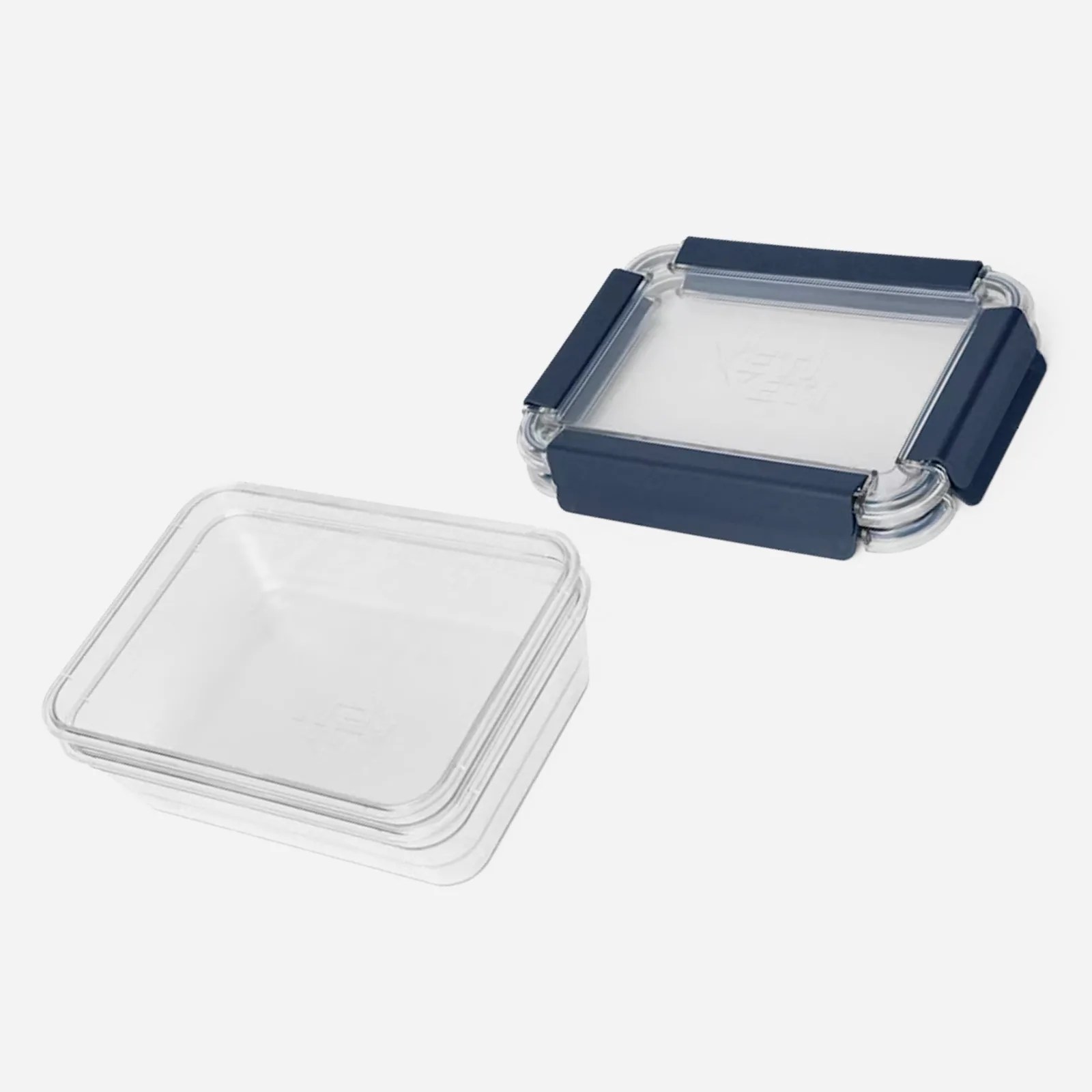 Three clean and empty Yeti food storage container bases and lids shown stacked and nested into each other against a light grey background. 