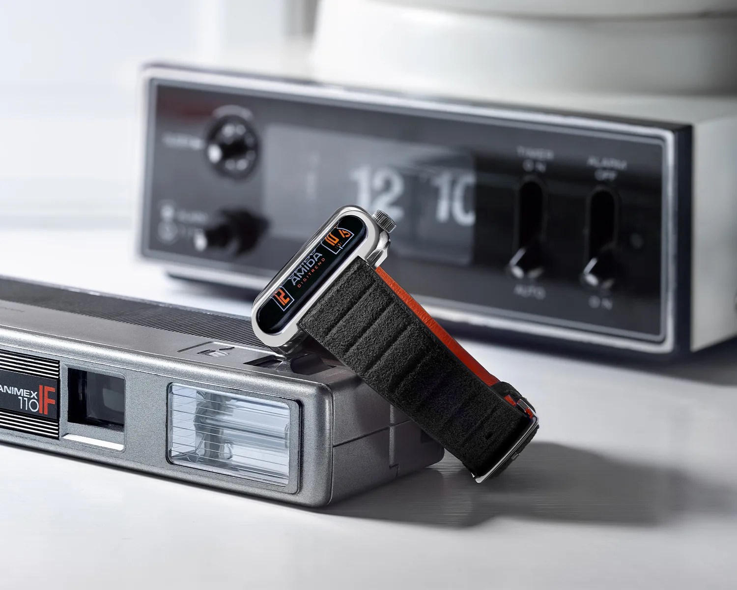 an amida digitrend watch leaning on some 1970s electronics
