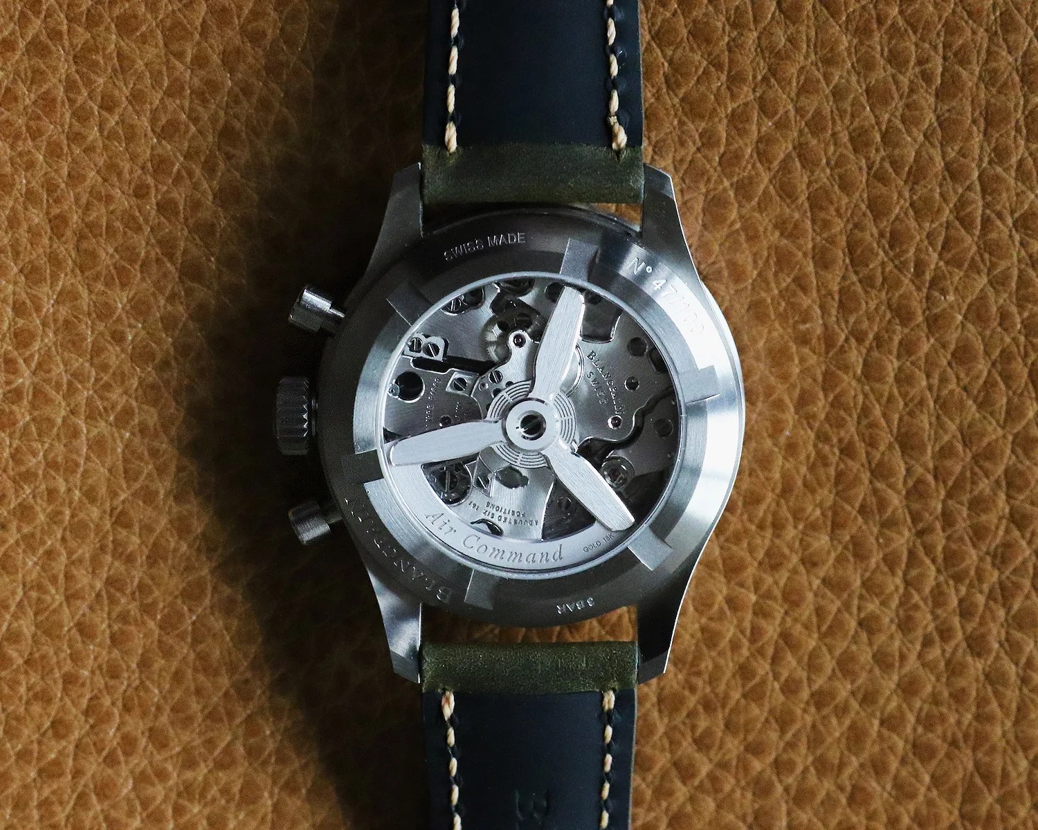 the automatic movement of a blancpain chronograph watch seen through a display caseback