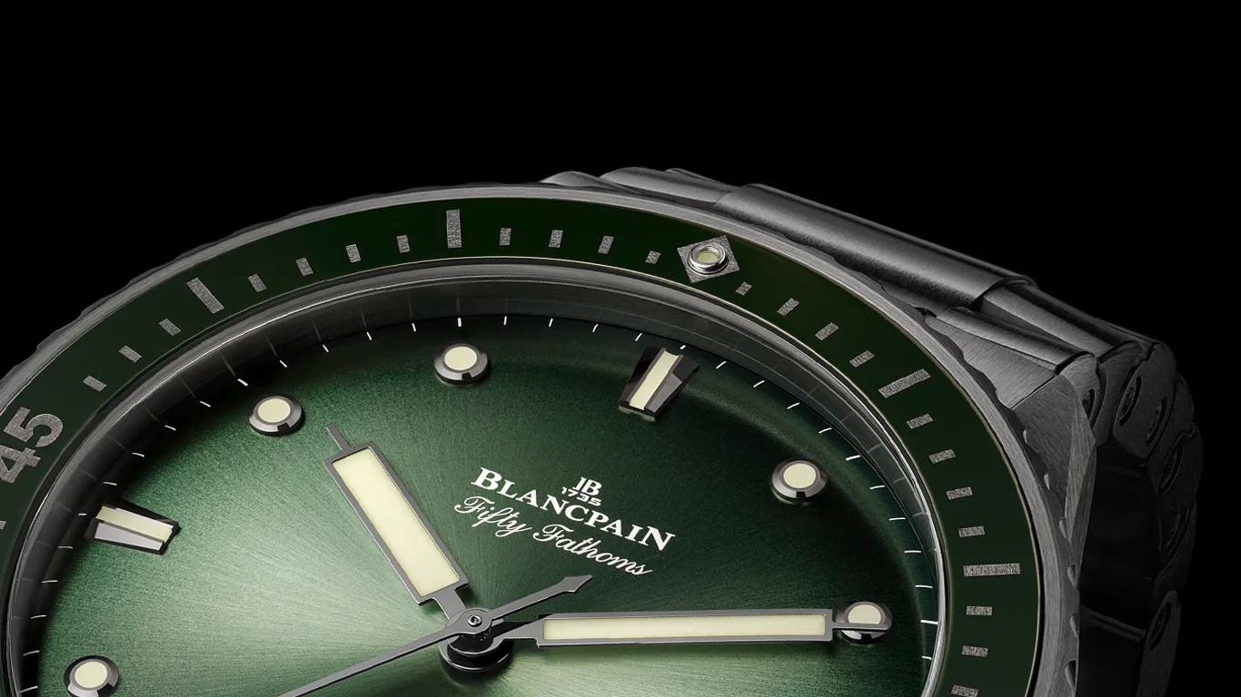 a closeup of a blancpain fifty fathoms ceramic dive watch