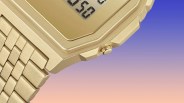 a gold casio x apc watch against a gradient background