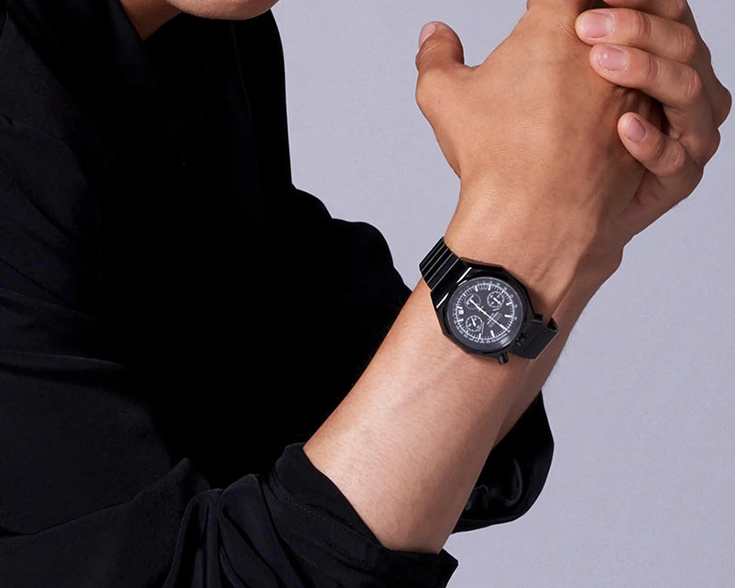 a black citizen ground y chronograph watch on a mans wrist