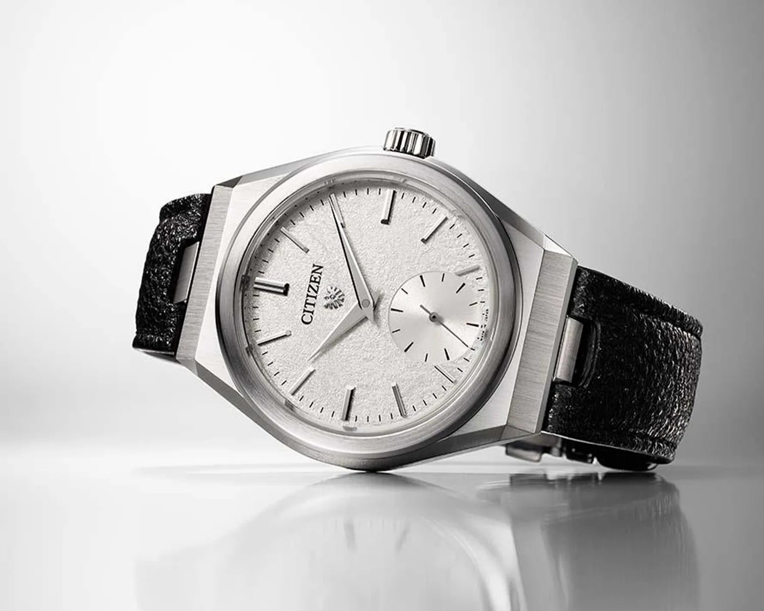 a citizen watch on its side