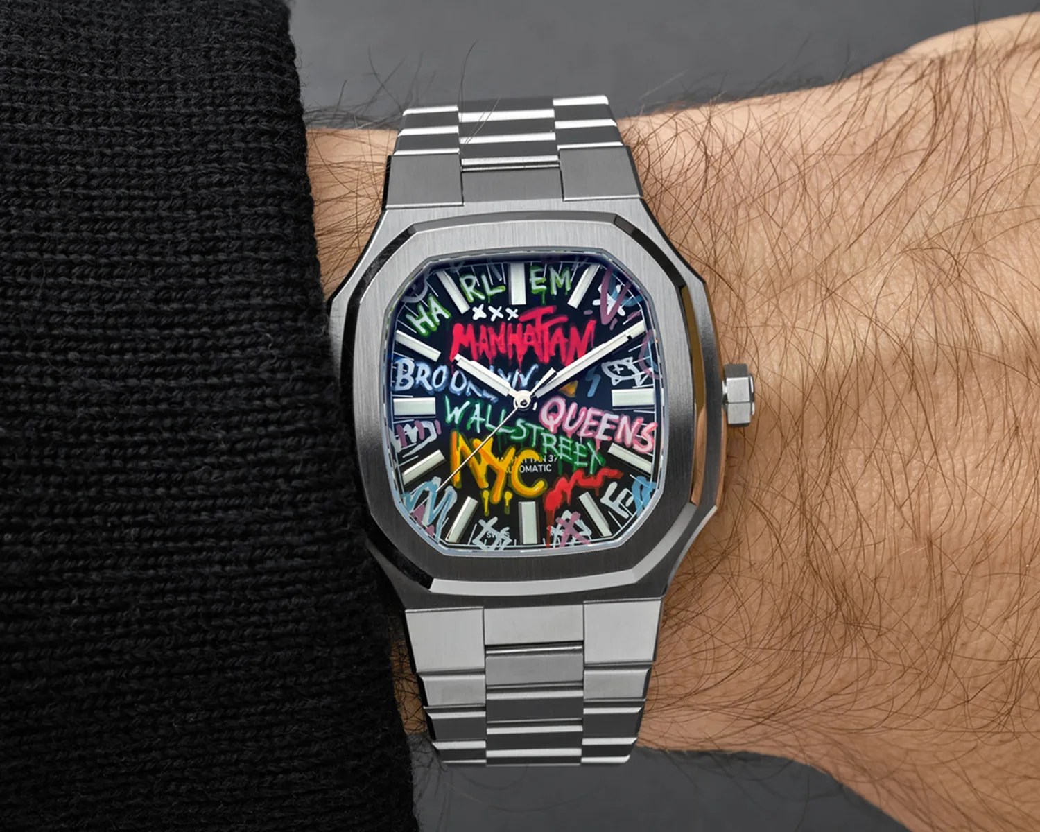 a maen manhattan watch on a mans wrist