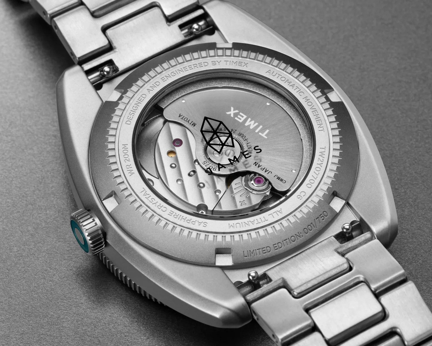the movement of a timex x the james brand gmt watch seen through its sapphire caseback
